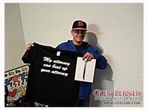 Photo of the Glen Lerner Gives Back Giveaway, Justin D. holding an iPad and Glen Lerner Injury Attorney t-shirt.