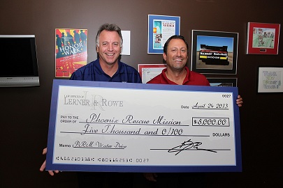 Attorney and founder of Lerner and Rowe Gives Back presents $5000 check to Phoenix Rescue Mission.